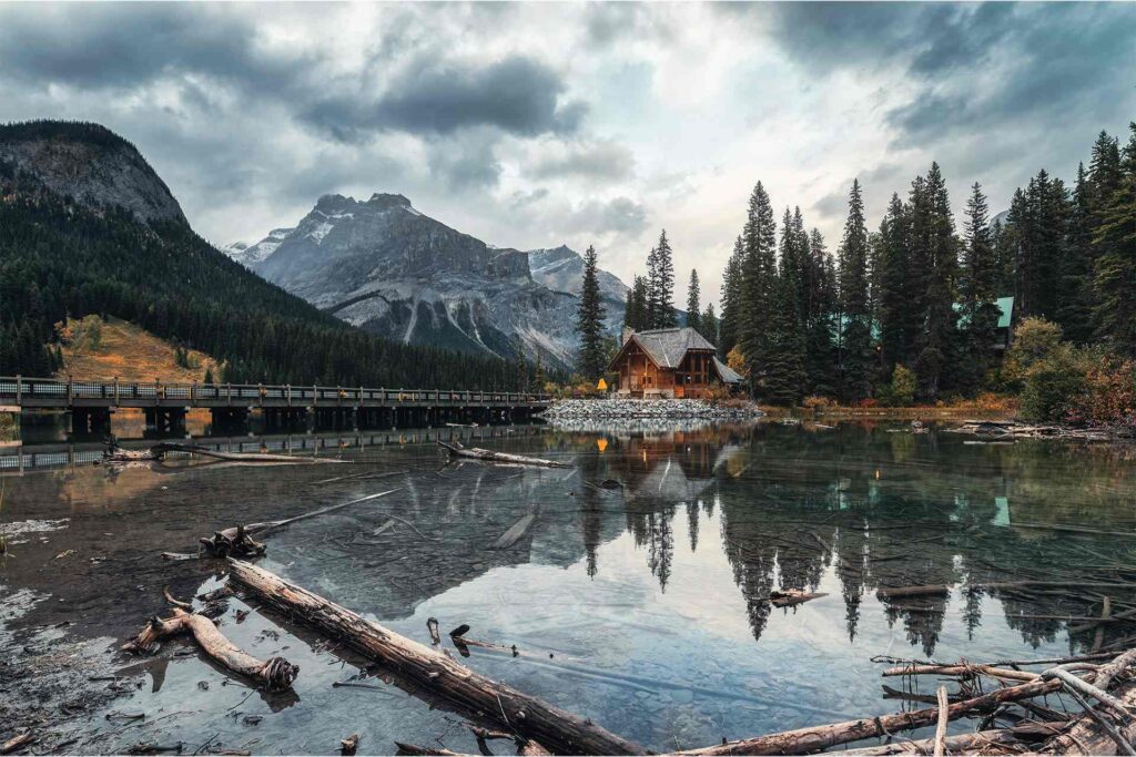 wooden cottage with rocky mountains reflection on 2024 01 02 22 28 28 EHLJVGX.jpg